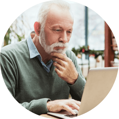 Older man looking at laptop